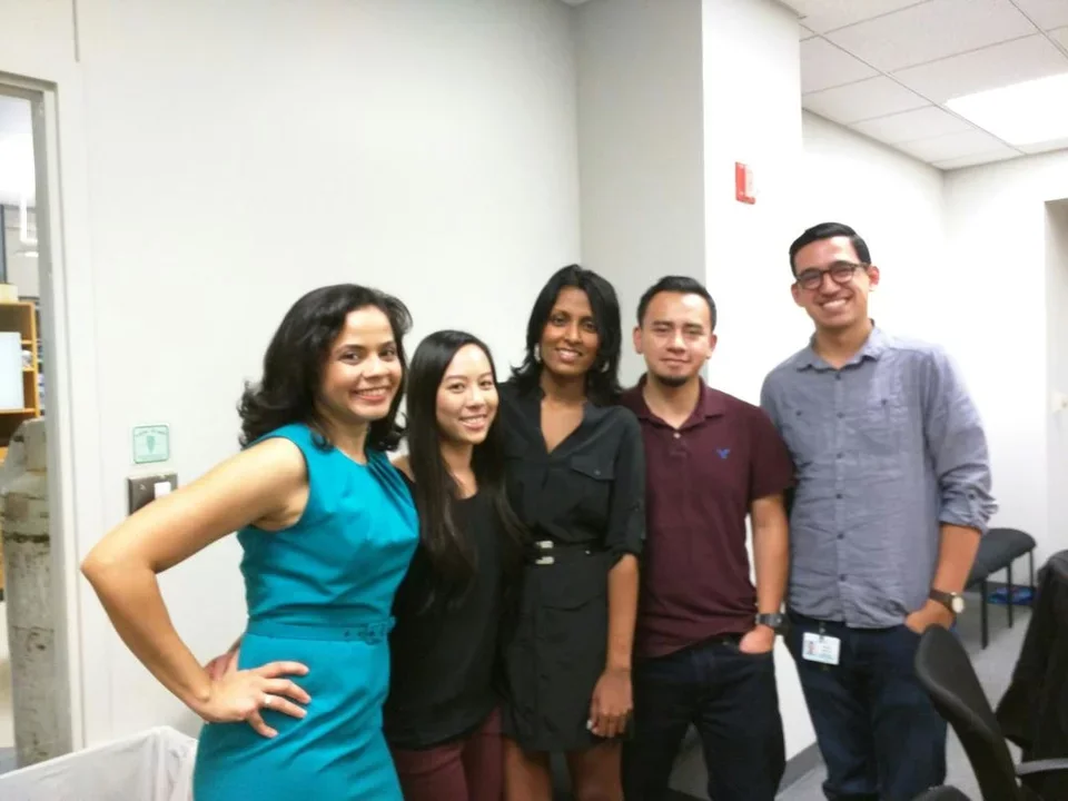 Lab members celebrate one of their own graduating with a PHD.